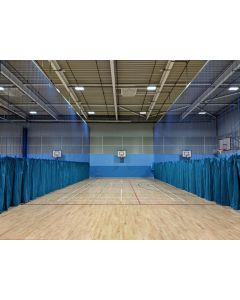 Sports hall division nets in blue to separate badminton courts