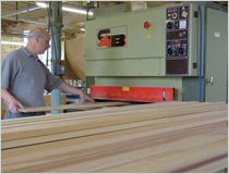 Planing timber in the joiners shop