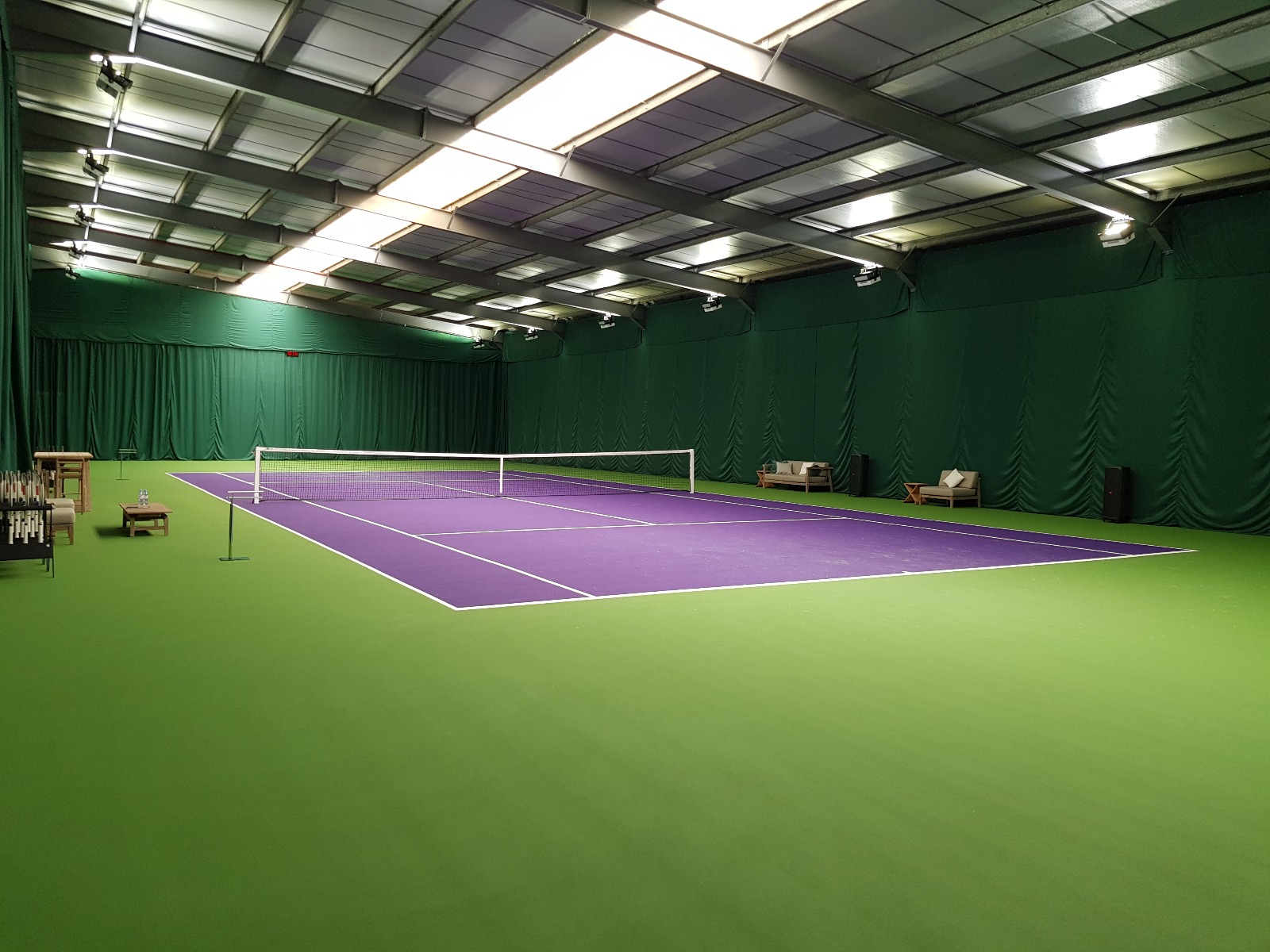 Indoor tennis hall perimeter drapes