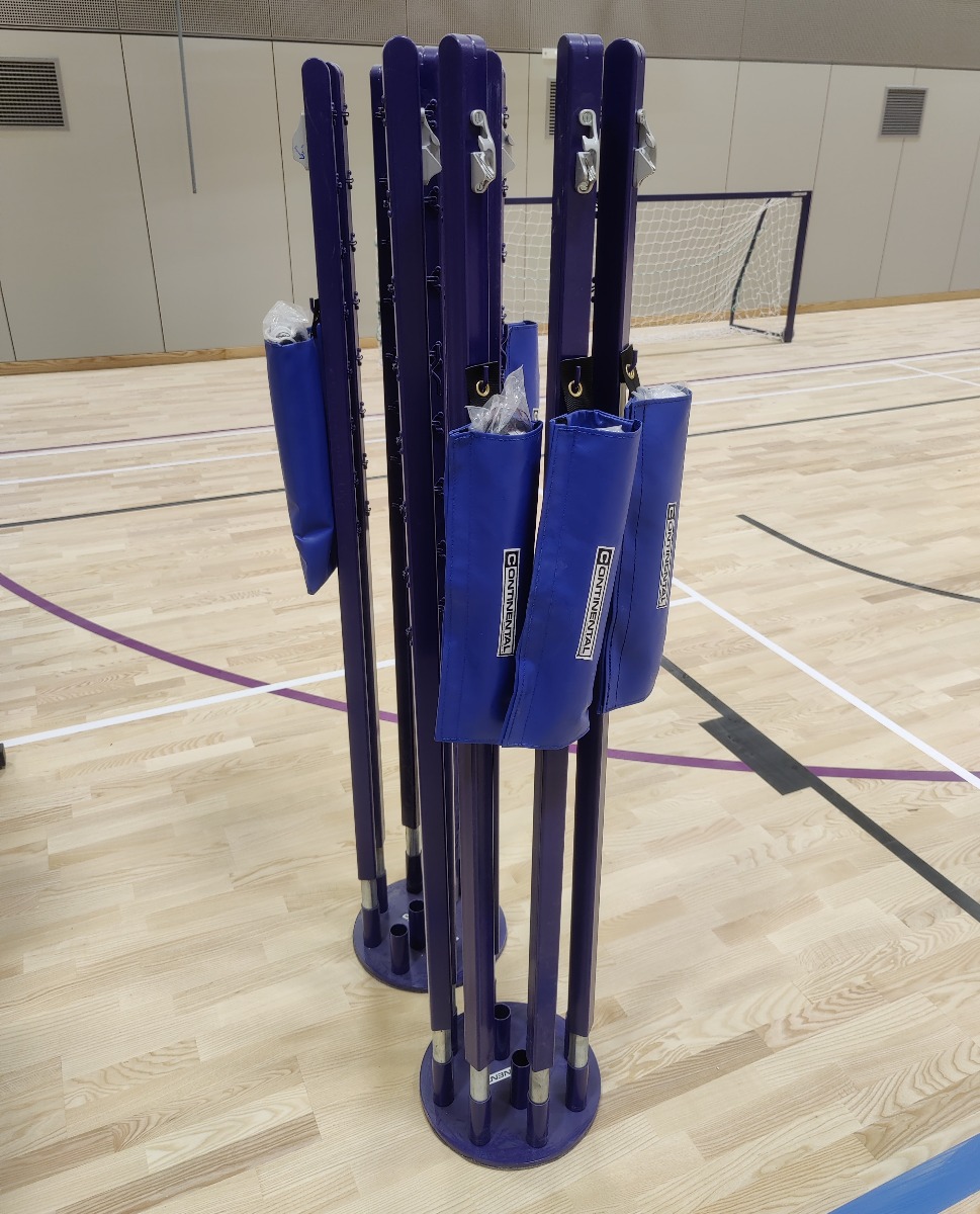 Socketed badminton post storage base